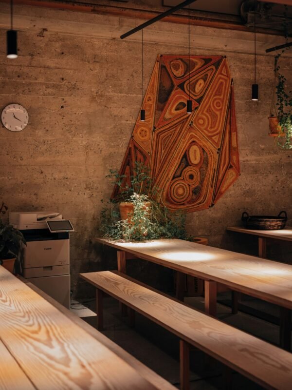 a wooden table and benches in a room