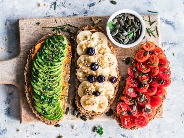 assorted fruits and vegetable assorted fruits and vegetable on brown wooden chopping board